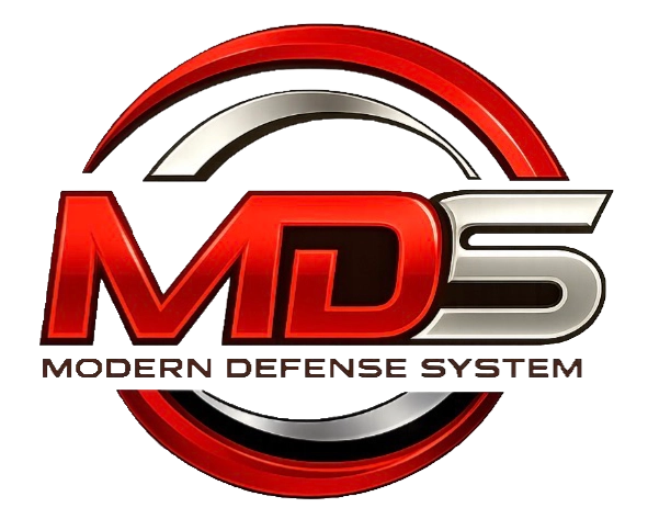 Logo des Modern Defense Systems (MDS) in rot und silber mit stilisierten Buchstaben und kreisförmigem Design.
